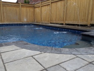 In ground pool with deck jets installed by CCS Pool and Landscape