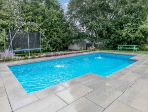 Fiberglass pool with modern paver