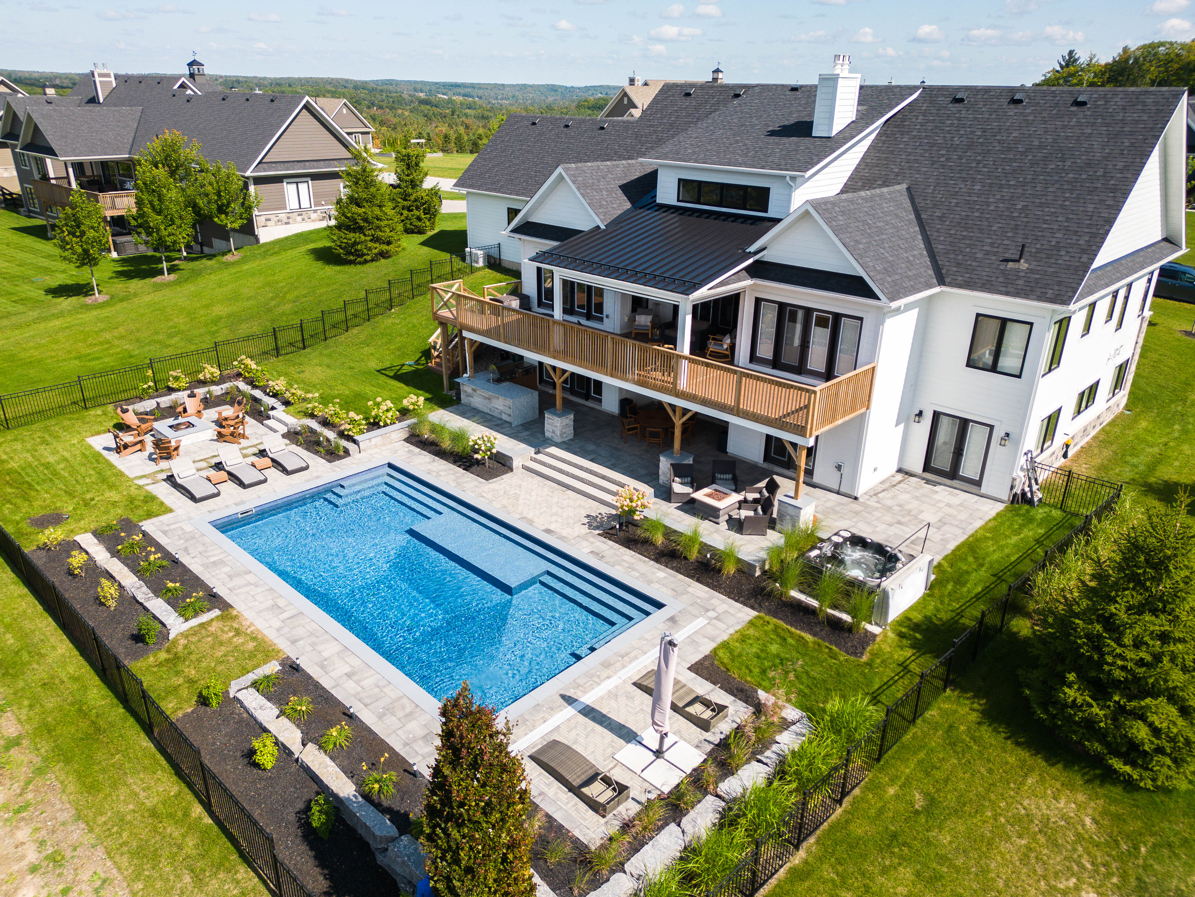 20x 40 with center custom pool stairs with splash pad / sun ledge